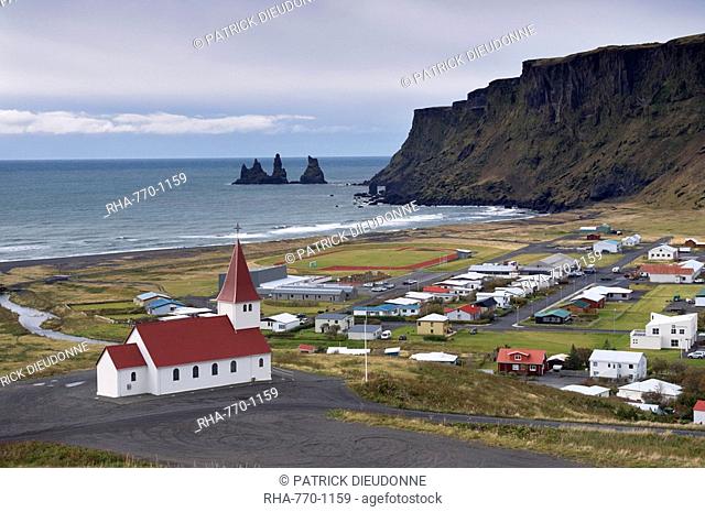 Church, village of Vik Vik a Myrdal and Reynisdrangar sea stacks in the distance, Iceland, Polar Regions