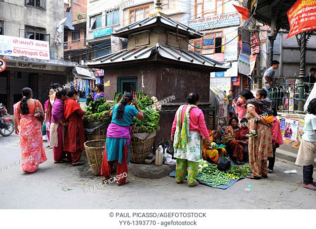 morning market in the front of street shrine , kathmandu, nepal