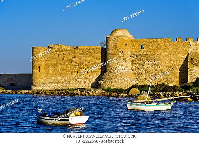 Africa, North Africa, Magreb, Djerba island. Governorat of Medenine. Houmt Souk. Fisherboats front of fort Borj El Kebir