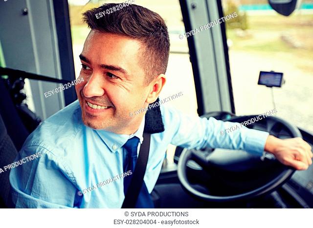 transport, tourism, road trip and people concept - happy driver driving intercity bus