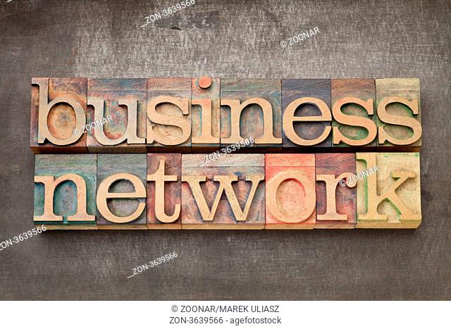 business network - text in vintage letterpress wood type on a grunge metal background