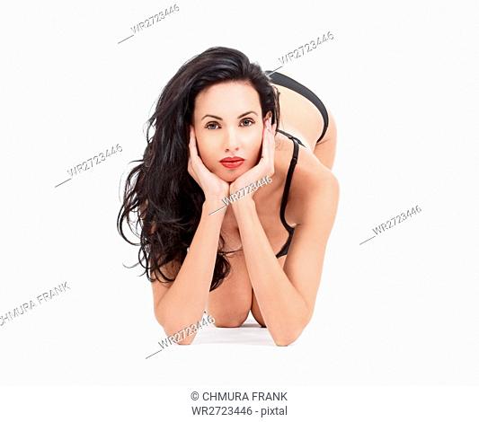 beautiful woman in black underwear looking at camera - isolated on white