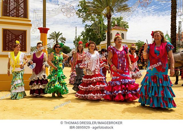 Women wearing gypsy dresses at the Feria del Caballo, Jerez de la Frontera, Cádiz province, Andalusia, Spain