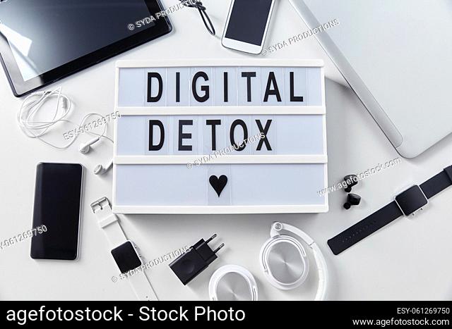gadgets and digital detox words on light box