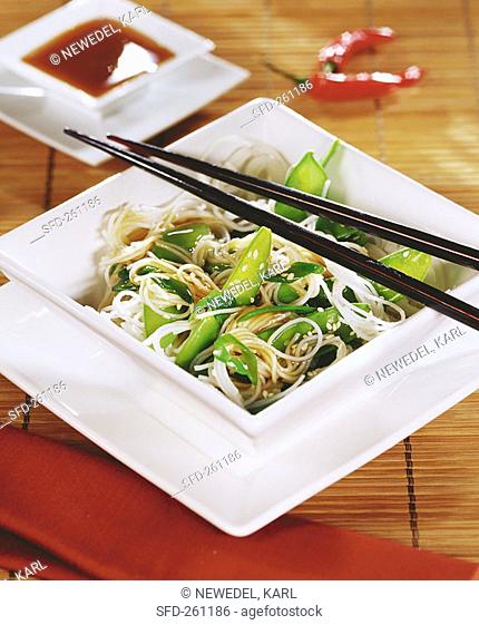 Fried rice noodles with mangetout and sesame