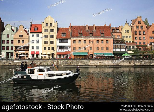 Poland, Gdansk, Colourful houses on Dlugle Pobreze, Stara Motlawa River & boat