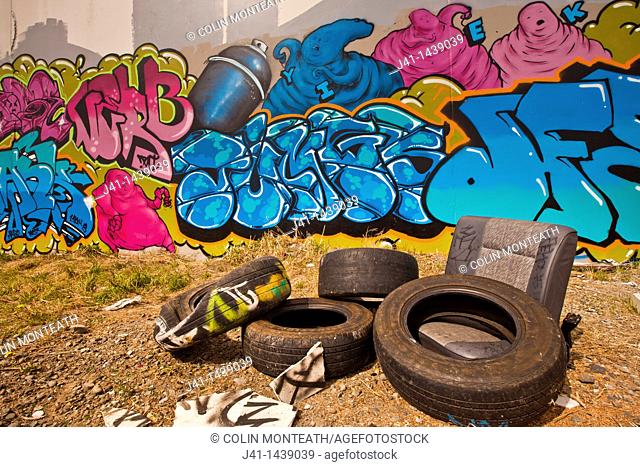 Street art, graffiti, ghosts and spray cans, old car tyres, near railway tracks, Christchurch