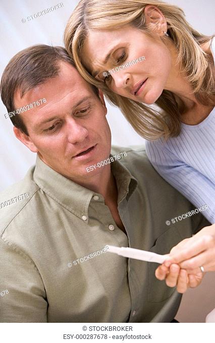 Couple with pregnancy test upset