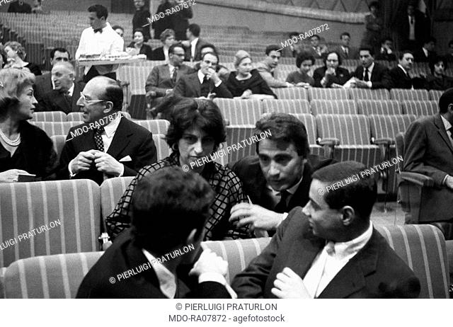 Italian actor, comedian and TV host Walter Chiari (Walter Annichiarico) with Italian actress Anna Magnani sitting in the stalls at Teatro Sistina in Rome during...