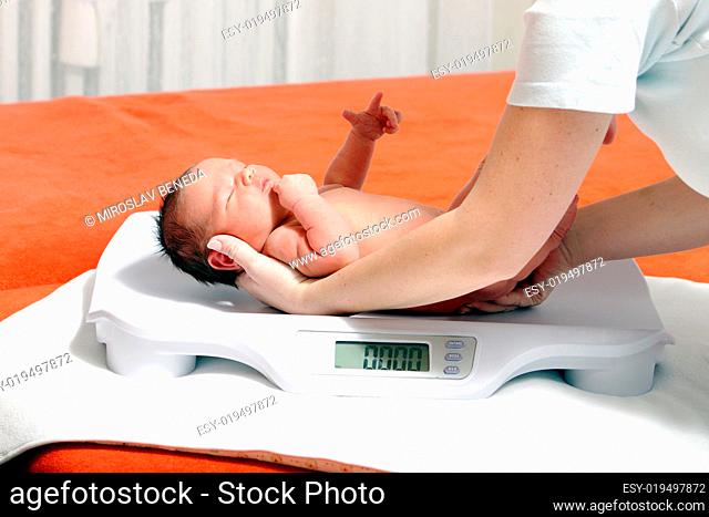 baby boy on weight scale