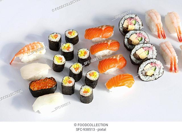 Various type of sushi on a white surface