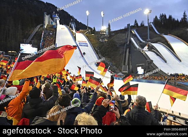 Overview jumping stadium, first again with spectators, general, German flags, flags on the grandstands, mood, full grandstands, ski jumping