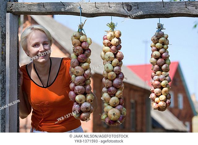 Happy Smiling Young Woman and Onion Bundle, Kasepää Village, Tartu County, Estonia
