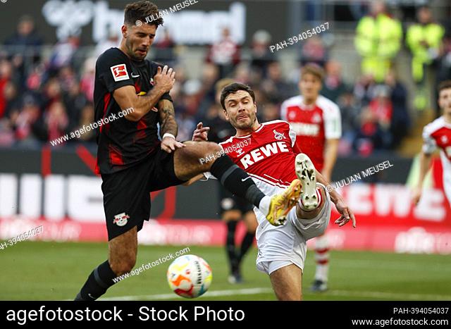 Jonas HECTOR (FC Cologne, #14) in duels with Dominik SZOBOSZLAI (RB Leipzig, #17) Soccer 1st Bundesliga / 19th matchday, matchday 19