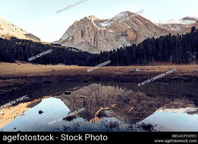 Reflection of mountain seen in puddle at Ibon Del Plan, Huseca, Spain