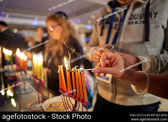 dpatop - 14 December 2023, Berlin: Hanukkah candles are lit at the Jewish Community Day 2023 at the Intercontinental Hotel