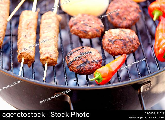 barbecue kebab meat and vegetables on grill