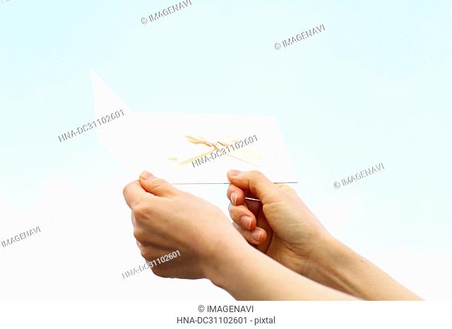 Woman Hand Holding Invitation Card