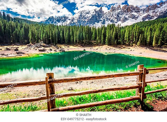 Breathtaking view to mountain Carezza lake in spring, Alps, Italy