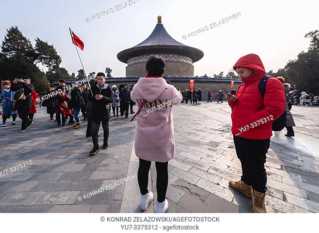 Tourists next to Imperial Vault of Heaven in Temple of Heaven in Beijing, China