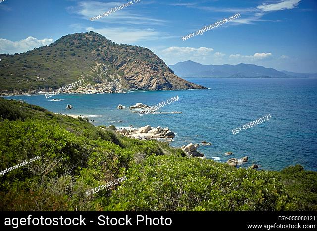 Natural inlet between the mountains and the sea in the south of Sardinia with the outline of a typical Mediterranean vegetation that grows spontaneously on the...