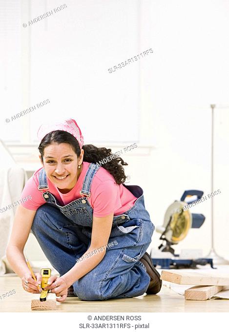 Woman using power tools at home