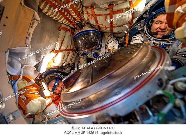 NASA astronaut Jeff Williams, left, Russian cosmonaut Alexey Ovchinin of Roscosmos, center, and Russian cosmonaut Oleg Skripochka of Roscosmos are seen inside...