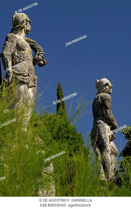 Statues of Villa Arvedi in tamarisk tree branches, Tamaricaceae, Grezzana, Veneto, Italy, 17th century