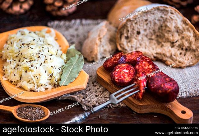 Farmer's Breakfast. Sausage, Sour Cabbage and Bread. Raw Ingredients and Seasoning