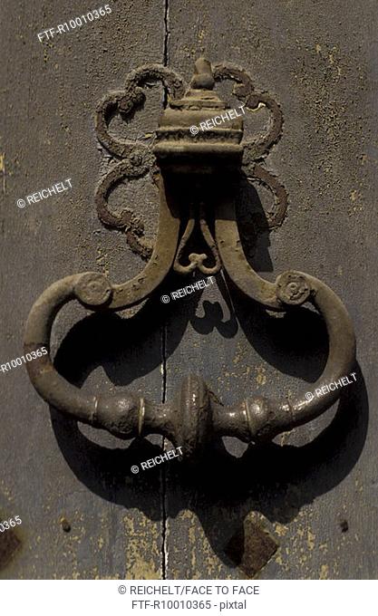 Door knocker on a door, Italy, Siena