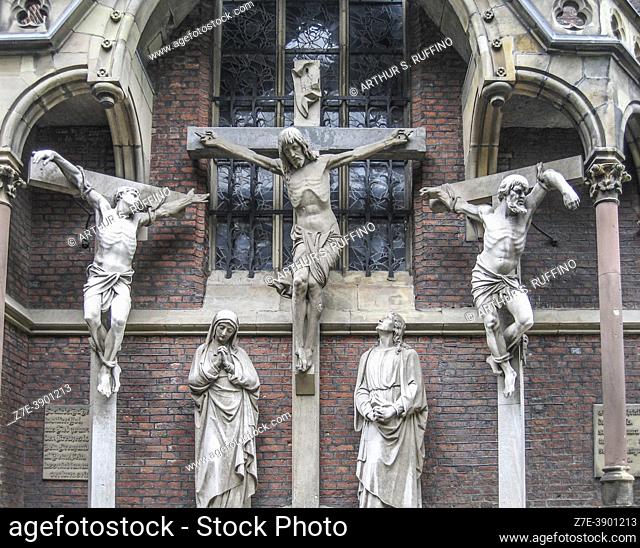 Sculptures depicting the Calvary crucifixions. Exterior of St. Lambertus Basilica, Stiftplatz, Dusseldorf, Germany