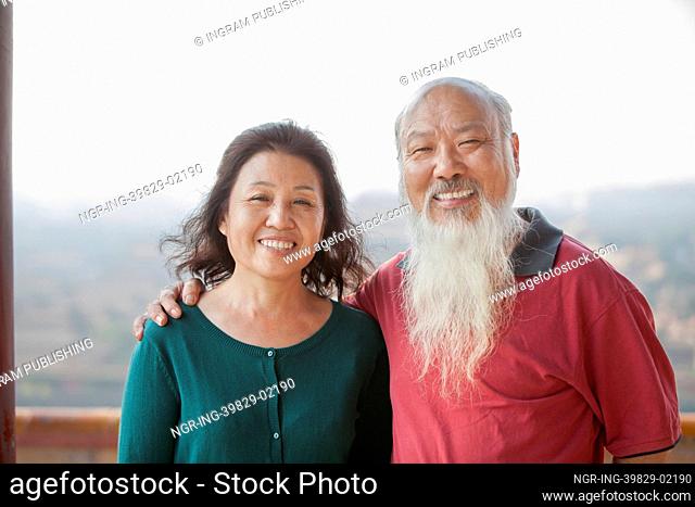 Portrait Of Smiling Old Couple In Jing Shan Park