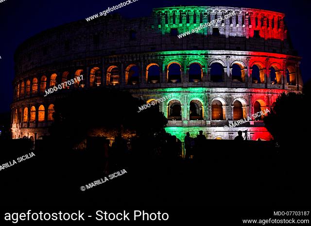 A part of the Flavian Amphitheater is illuminated with the Italian tricolor on the occasion of the reopening of the archaeological park of the Colosseum after...