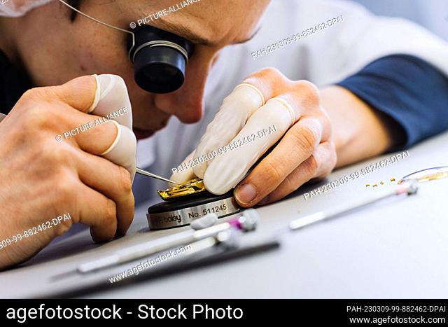 PRODUCTION - 07 March 2023, Baden-Württemberg, Schramberg: A Junghans employee assembles a watch. The watch manufacturer Junghans was founded in 1861 in...