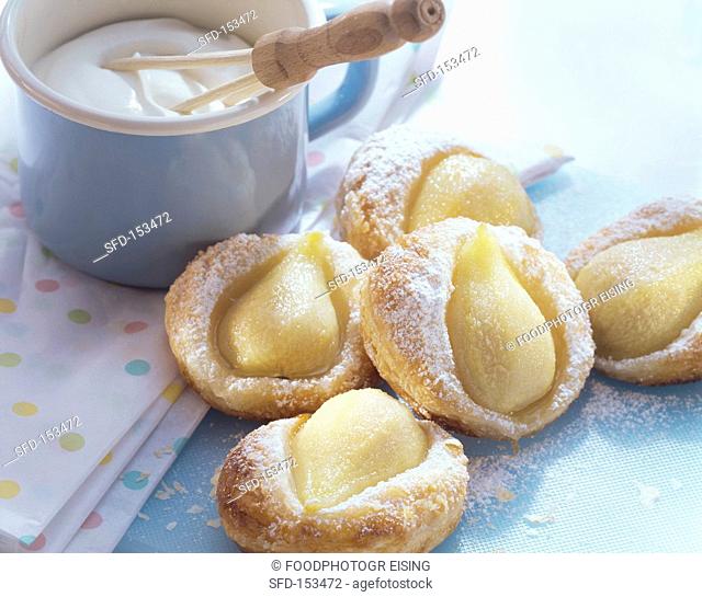 Warm puff pastry pear tartlets with cream