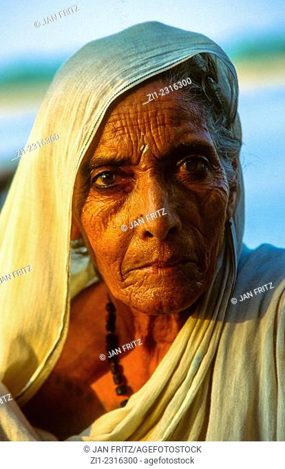 portrait of old woman at the ghats of varanasi, india