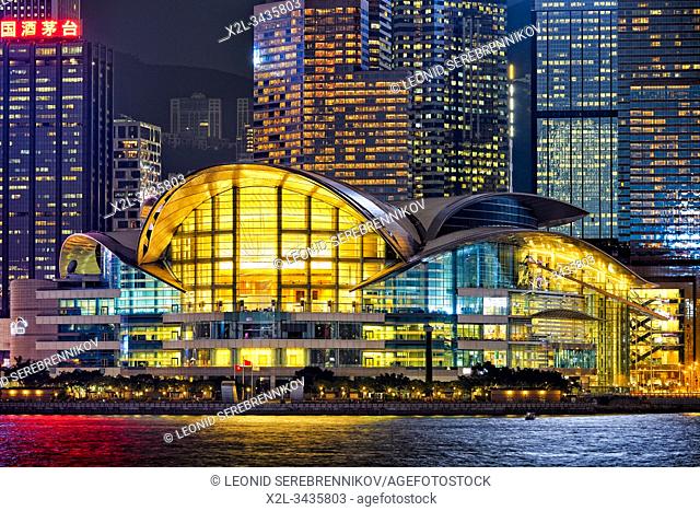 Central Waterfront buildings illuminated at night. Hong Kong, China