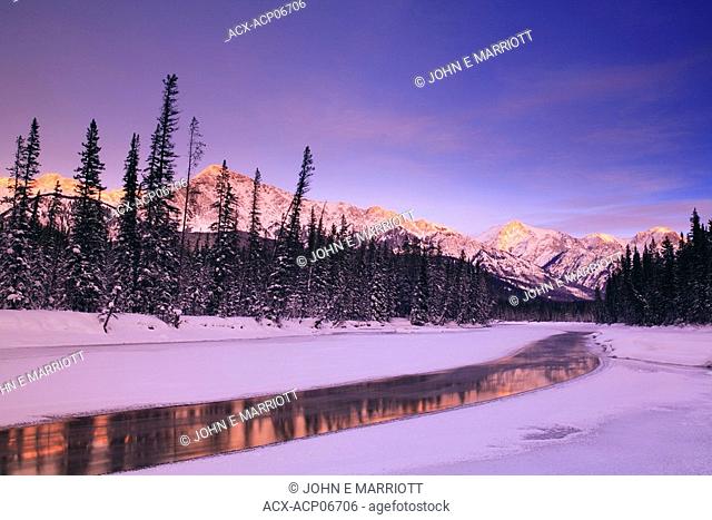 The Bow River and the Sawback Range at sunset in winter, Banff National Park, Alberta, Canada