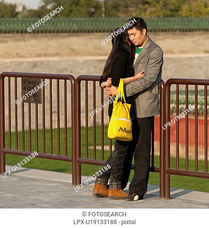 Couple romancing at the Temple Of Heaven, Beijing, China