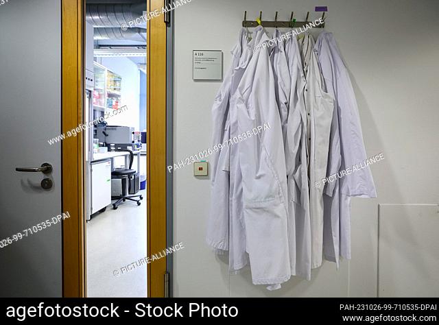 26 October 2023, Saxony, Leipzig: Gowns hang next to a lab at the Helmholtz Institute for Metabolism, Obesity and Vascular Research (HI-MAG)
