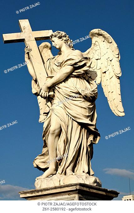 Sculpture of Angel with the Cross by Ercole Ferrata on Ponte Sant'Angelo also known as Bridge of Hadrian in Rome, Italy