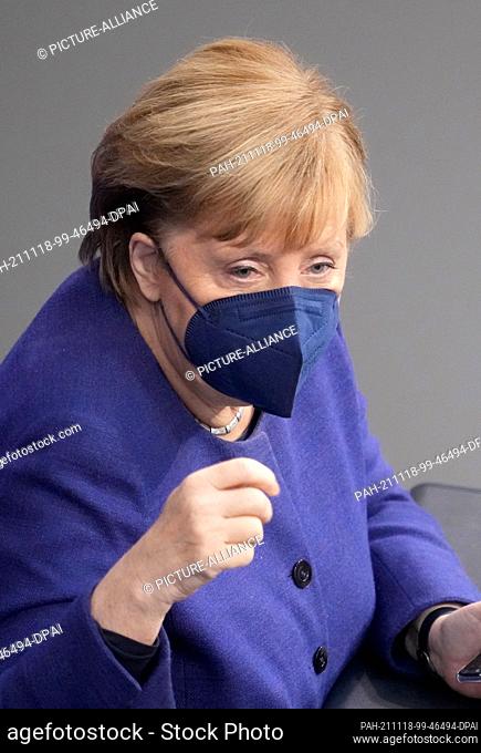 18 November 2021, Berlin: Federal Chancellor Angela Merkel (CDU) attends the session of the Bundestag. Topic among others second and third deliberation of the...