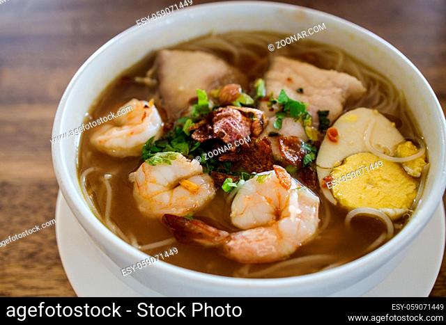 Prawn and fish in indonesian spicy soup rice noodle called soto