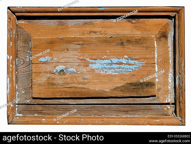 The wooden panel of the old retro rustic door is covered with cracked varnish polish. Isolated on white sunny day outdoor shot