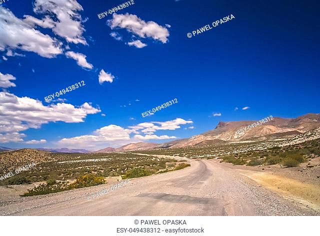 Empty road through dry mountain landscape in the northern part of Argentina