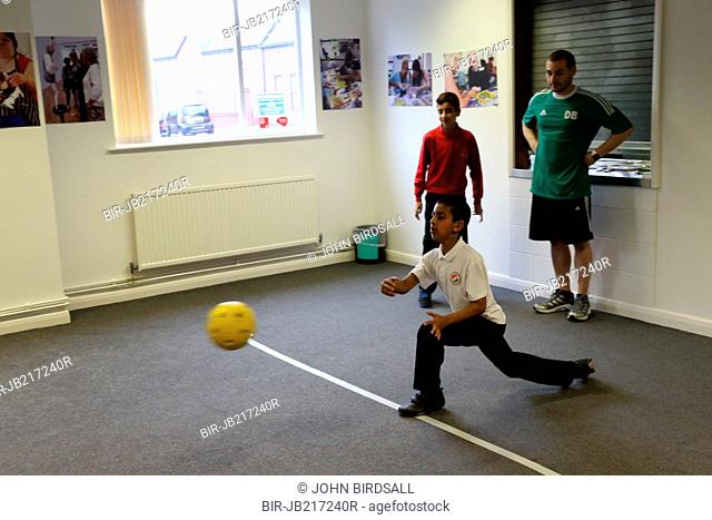 Boys with visual impairments being taught Goalball at Mysight, Nottingham