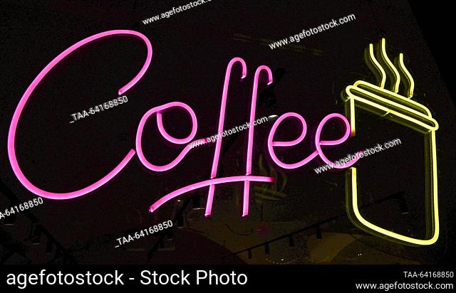 RUSSIA, MOSCOW - OCTOBER 30, 2023: A Coffee sign outside a coffee shop in Pokrovka Street at night. A group of Russian State Duma members led by Yelena...