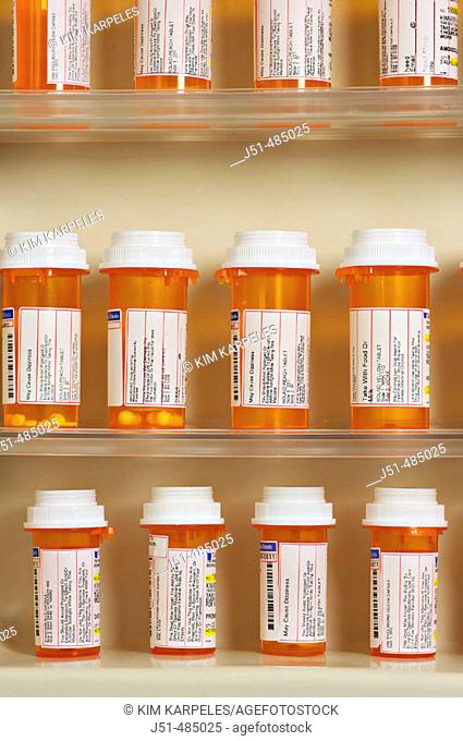 STILL LIFE. Riverwoods, Illinois. Bottles of prescription drugs on shelves, bathroom medicine cabinet