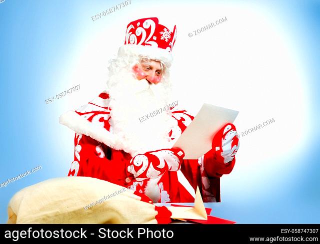Santa Claus on blue background. Christmas holiday party