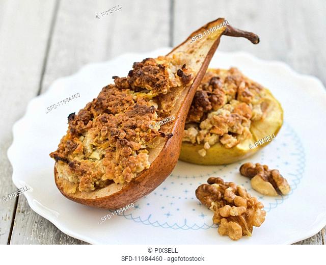 Baked pear and apple filled with walnuts and almonds and topped with crumble
